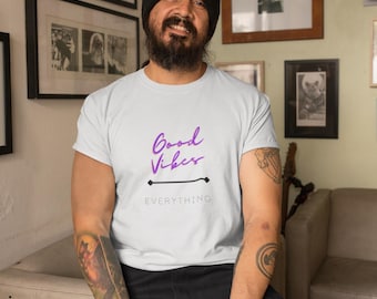 Channel your inner optimist with our "Good Vibes Over Everything" Unisex Heavy Cotton T-Shirt