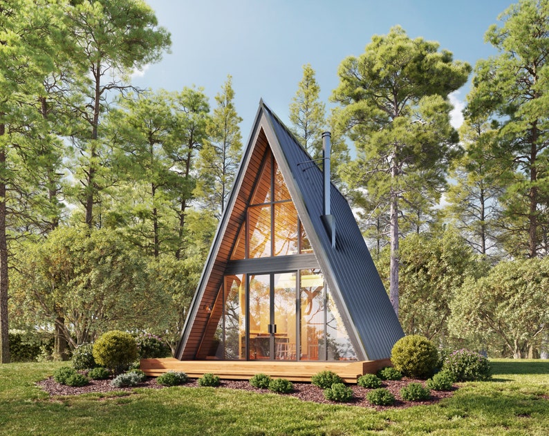 May include: A modern A-frame cabin with a large window and a wooden deck. The cabin is surrounded by trees and has a black metal roof.