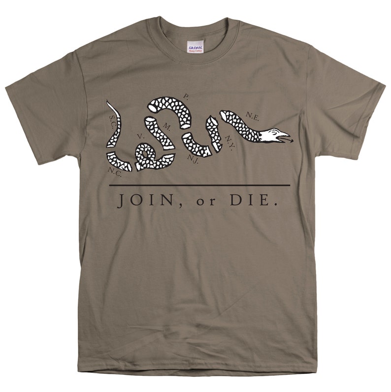 May include: A brown t-shirt with a black and white image of a snake with the words "JOIN, or DIE." and the abbreviations of the original 13 colonies.