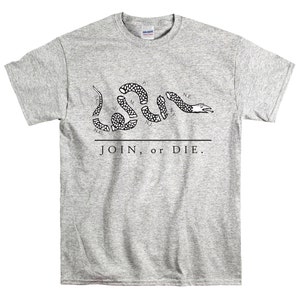 May include: A grey t-shirt with a black and white image of a snake with the words "JOIN, or DIE." printed on it.
