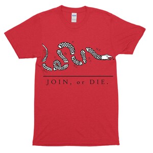 May include: Red t-shirt with a black and white image of a snake with the words "JOIN, or DIE." printed on it.