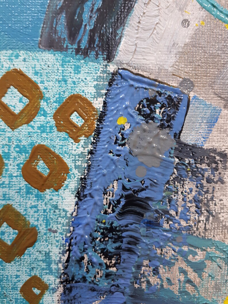 May include: Abstract painting with a blue, grey, and white background. The painting features a variety of shapes and textures, including squares, circles, and lines. The painting is done in a bold and expressive style.