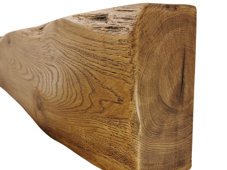 May include: A rustic, reclaimed wood beam with a natural, brown finish. The wood has a unique grain pattern and knots, giving it a characterful look.