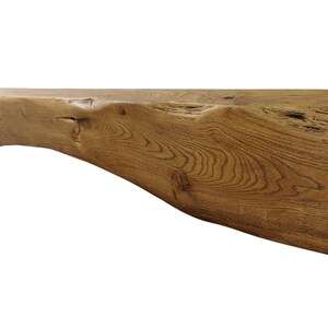 dark oak rustic mantel beam with arched bottom