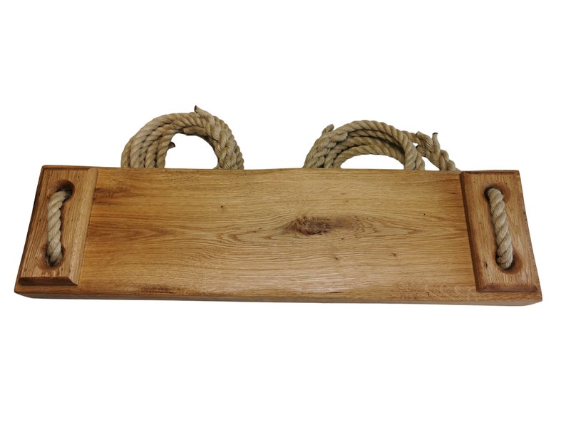 May include: A wooden swing set with rope handles. The swing is made of natural wood and has a rustic look.