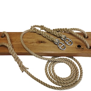 Rustic solid oak tree swing with twisted hemp ropes and steel adjusters.
Chorley oak logo is branded into the wooden swing seat