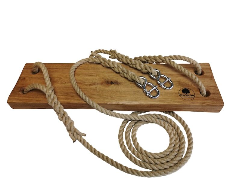 Rustic solid oak tree swing with twisted hemp ropes and steel adjusters.
Chorley oak logo is branded into the wooden swing seat