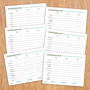 May include: Five white sheets of paper with the word "Scattegories" printed in green at the top. Each sheet has a list of categories and blank lines for writing words. The game is designed to help players think of words that fit into different categories.