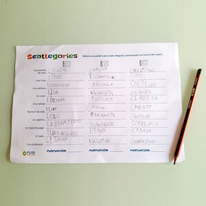 May include: A white sheet of paper with the word "Scattegories" printed at the top. The paper is divided into three columns, each with a different letter at the top. Under each letter, there are several categories, and the player must write a word that fits the category and starts with the letter at the top of the column. The categories include "a piece of clothing", "a fruit", "a vegetable", "a color", "a drink", "a girl's name", "an adjective", "a sport/game", "a country", and "a profession".