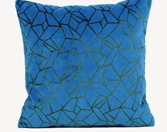 May include: A blue velvet throw pillow with a geometric pattern in a darker shade of blue.