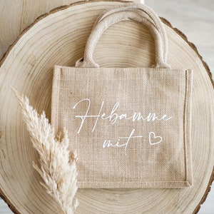 Tasche für Hebamme mit der Aufschrift Hebamme mit Herz. Kleine Aufmerksamkeit als Dankeschön für die gute Betreuung im Wochenbett