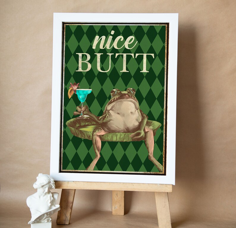 May include: A green and white poster featuring a frog perched on a lily pad, holding a blue cocktail. The poster reads "nice BUTT" in large yellow lettering.