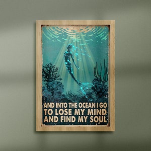 May include: A vintage-style poster with a mermaid swimming in an ocean scene. The text reads "And into the ocean I go to lose my mind and find my soul."