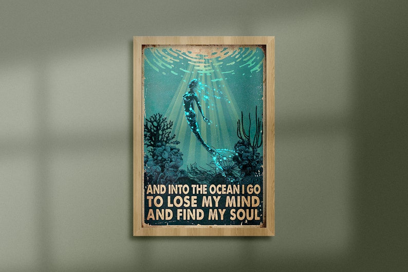 May include: A vintage-style poster with a mermaid swimming in an ocean scene. The text reads "And into the ocean I go to lose my mind and find my soul."