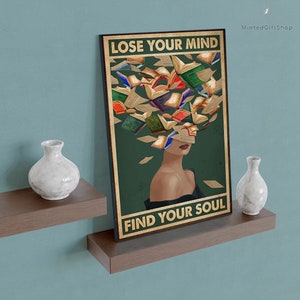 May include: A vintage-style poster with a woman's face surrounded by colorful books. The text on the poster reads "Lose Your Mind Find Your Soul".