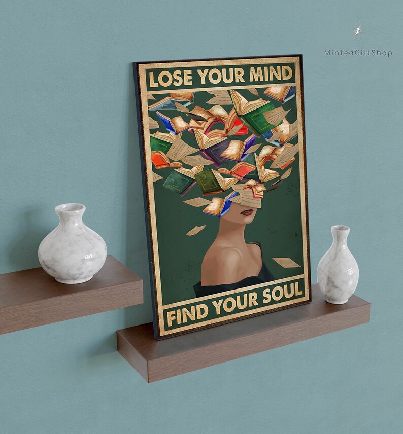 May include: A vintage-style poster with a woman's face surrounded by colorful books. The text on the poster reads "Lose Your Mind Find Your Soul".