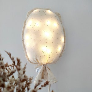 Luminous ecru wall balloon with gold polka dots