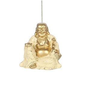 May include: A gold and white ceramic figurine of a smiling Buddha sitting with his legs crossed. The Buddha is wearing a white robe and has a gold necklace.