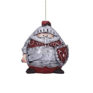 Puede incluir: Una figura redonda de caballero de plata y rojo con una espada y un escudo. El caballero lleva un casco y tiene un diseño rojo y plateado en su armadura.