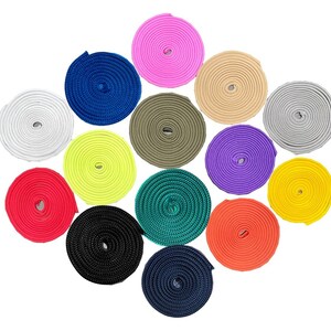 May include: A collection of 14 spools of colourful nylon webbing in various colours, including red, yellow, green, blue, purple, pink, and black.
