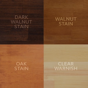 Puede incluir: Una cuadrícula de seis muestras de color que muestran acabados de madera y colores de pintura. Las opciones incluyen Dark Walnut Stain, Walnut Stain, Matte Black Paint, Oak Stain, Clear Varnish y White Paint.