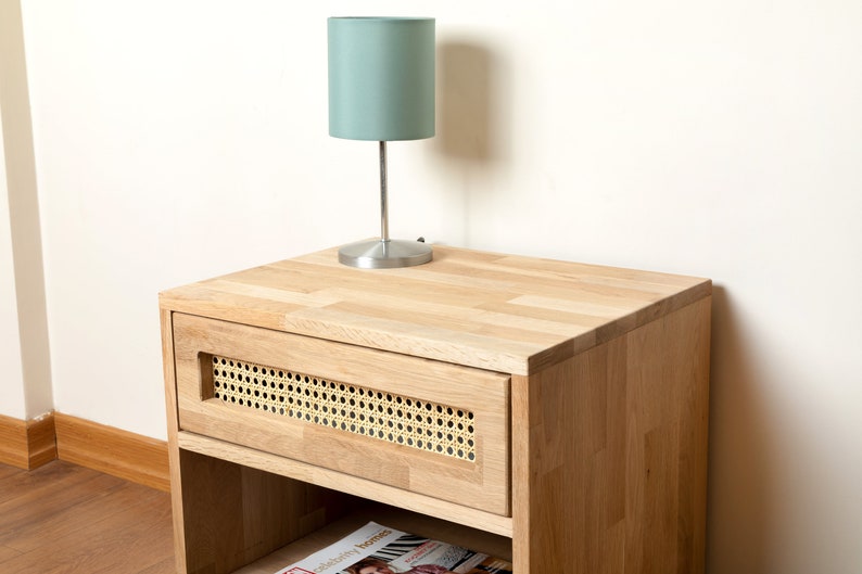 Night lamp and your books are sitting perfectly on the oak nightstand.