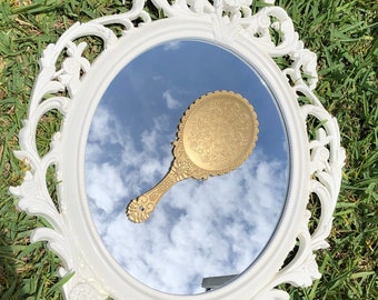 Gold hand mirror