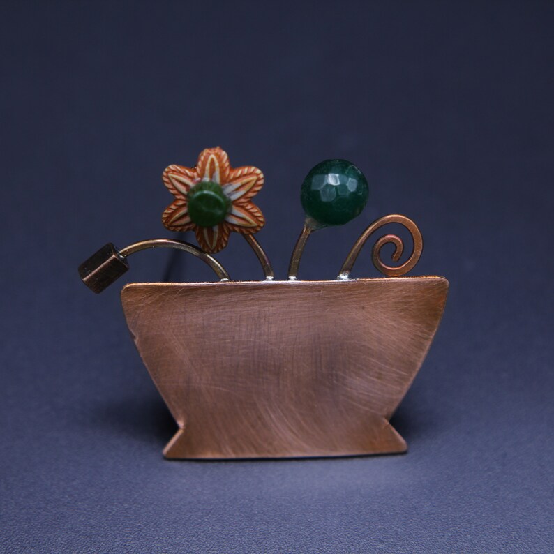 copper or alpacca jar brooch with glass beads