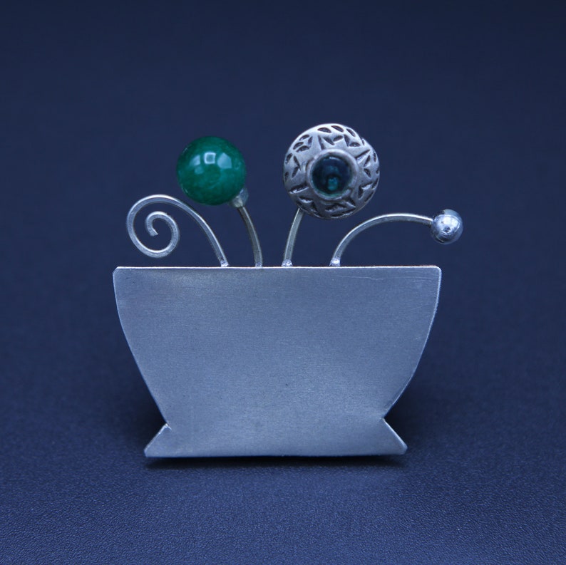 copper or alpacca jar brooch with glass beads