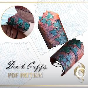 May include: A PDF pattern for making a pair of brown leather arm cuffs with green ivy leaf details. The cuffs are shown on a white background with a blue and white woodgrain pattern. The text "Druid Cuffs PDF PATTERN" is also included in the image.