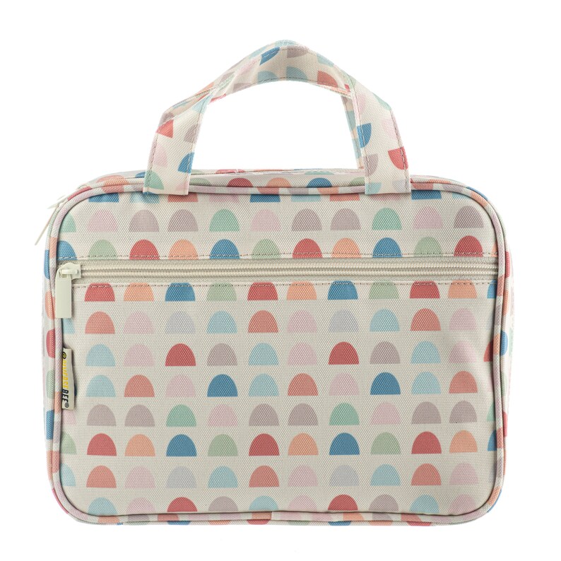May include: A white toiletry bag with a zipper closure and a top handle. The bag has a colorful pattern of semi-circles in shades of pink, blue, green, and orange.