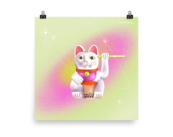 May include: A white lucky cat figurine with a pink collar and a green straw, holding a cup of boba tea with brown tapioca pearls. The background is a light green with pink and white speckles.