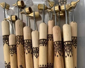 May include: A set of 12 wooden henna tattoo tools with brass tips. Each tool has a different geometric design burned into the wood.