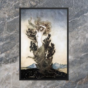 Puede incluir: Una impresión enmarcada de una mujer desnuda con cabello largo y ondeante, integrada en una forma de árbol. La obra de arte utiliza tonos apagados de beige, gris y negro, con un toque de azul en el fondo, sugiriendo un paisaje con montañas.