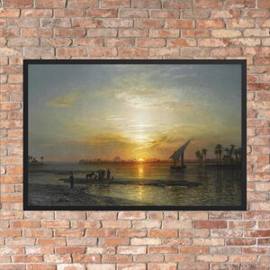 May include: Framed print of a sunset over a river, with a sailboat, pyramids, and palm trees. The artwork uses warm colours of orange, yellow, and gold, with a black frame. The scene depicts a historical landscape.