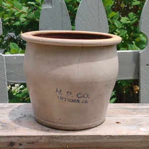 May include: A white ceramic crock with a blue inscription that reads "H. P. CO.  AWTHORN, PA".