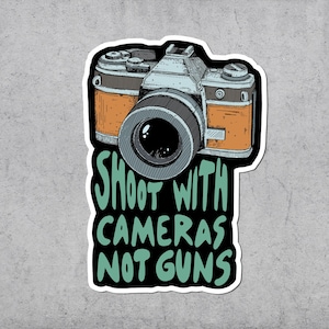Schieten met camerasticker, politiek, geen wapens, protest, vinylstickers, antioorlog, marxistisch, antikapitalisme