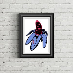 May include: Framed art print featuring a stylized illustration of a peeled banana. The banana peel is blue, and the fruit is pink with the word "ACAB" in black. The artwork is set against a white background.