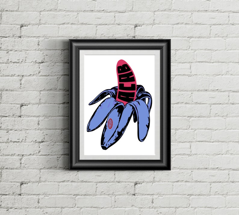 May include: Framed art print featuring a stylized illustration of a peeled banana. The banana peel is blue, and the fruit is pink with the word "ACAB" in black. The artwork is set against a white background.