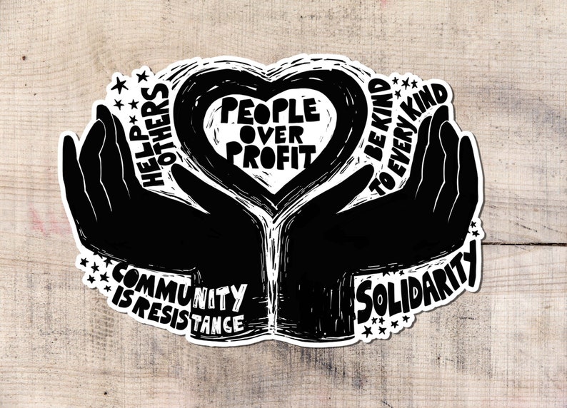 May include: A black and white sticker with the words "People Over Profit" inside a heart shape, held by two silhouetted hands. Additional text includes "Help Others," "Community is Resistance," "Be Kind to Every Kind," and "Solidarity."