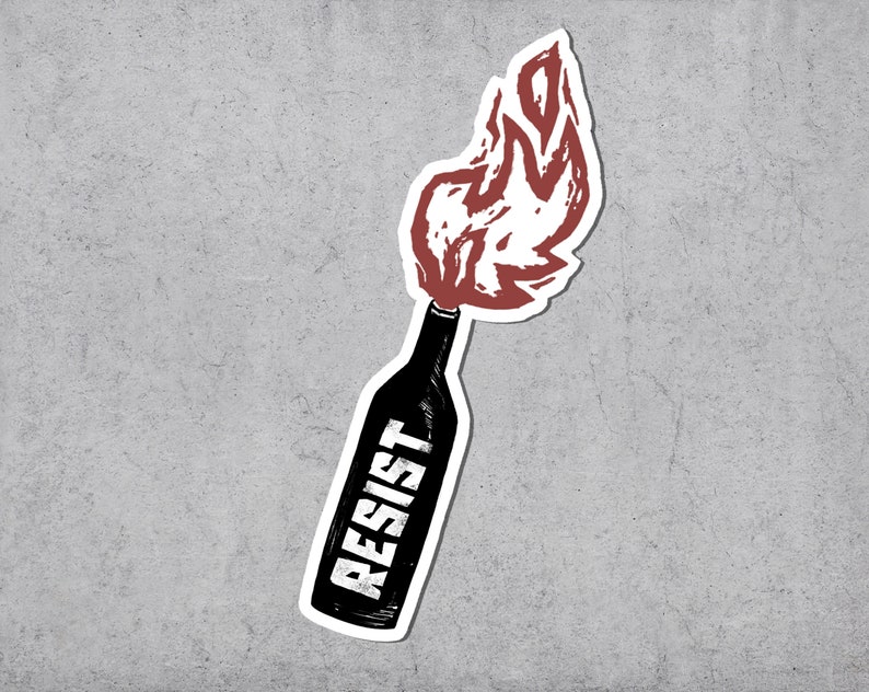 May include: A sticker featuring a black bottle with the word "RESIST" in white, with flames in red and white emanating from the top. The design has a hand-drawn, illustrative style, set against a gray background.