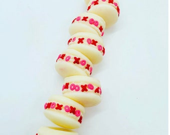Hearts & X’s and O’s Macaroon Wax Melts coated with candy in the center.