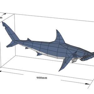May include: A low-poly blue hammerhead shark sculpture with a geometric surface. The shark is enclosed in a wireframe box with dimensions labeled as 340mm in depth, 440mm in height, and 900mm in length, indicating its overall spatial footprint.