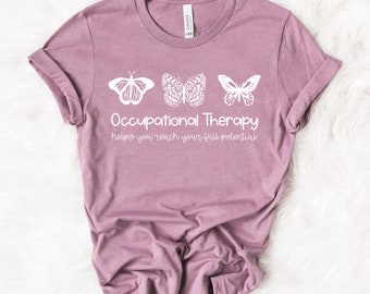 May include: A mauve t-shirt with a white graphic of three butterflies and the text "Occupational Therapy help you reach your full potential."