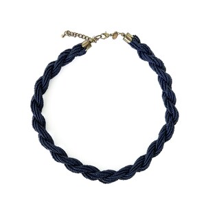 May include: A dark blue beaded necklace with a braided design. The necklace has a silver clasp.