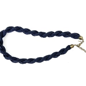 May include: A dark blue beaded necklace with a twisted design and a gold clasp.