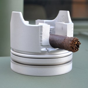 HUM V Cigar Ashtray made from a military HMMWV (Humvee)piston.