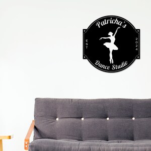 May include: Black and white sign with a ballerina silhouette, the text "Patricha's Dance Studio", "EST 2024", and a decorative border.
