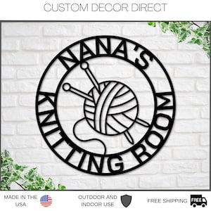 May include: Black metal sign with a circle design. The circle has the words "Nana's Knitting Room" written around the edge. Inside the circle is a ball of yarn with two knitting needles.