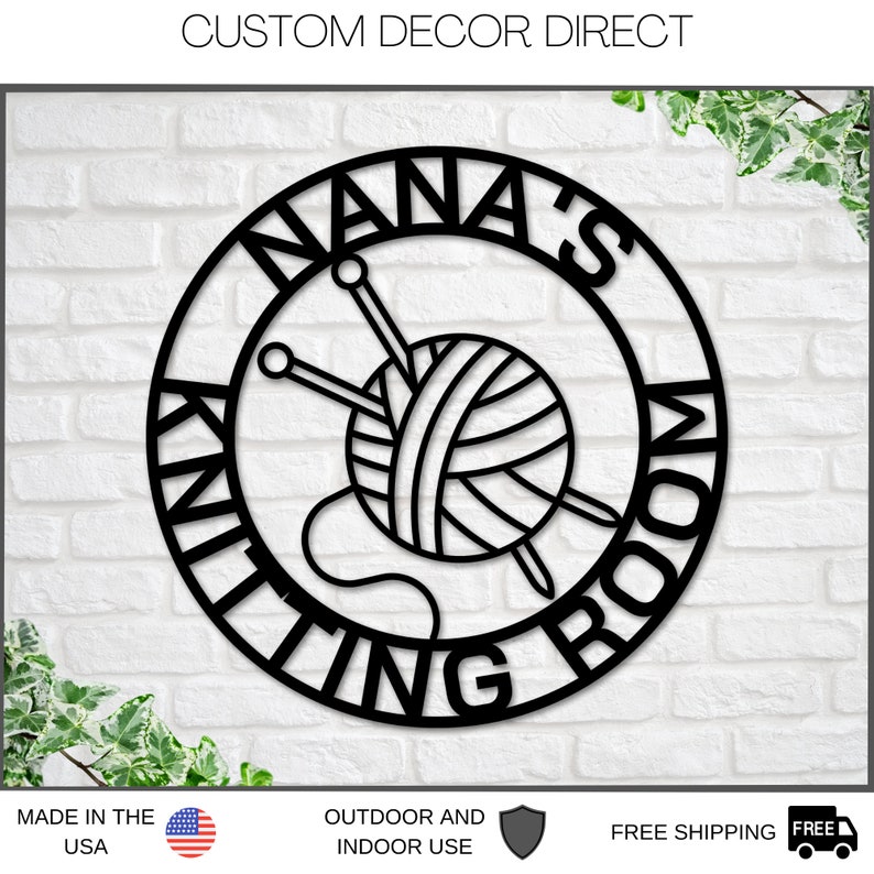 May include: Black metal sign with a circle design. The circle has the words "Nana's Knitting Room" written around the edge. Inside the circle is a ball of yarn with two knitting needles.